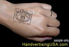 a person's hand with a stamp on it that says jack daniels old no 7