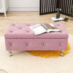 a pink bench sitting on top of a white rug