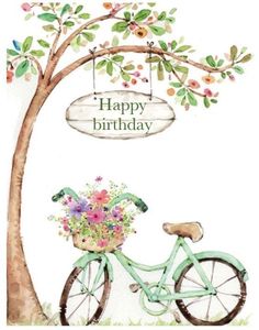 a birthday card with a bicycle and flowers on the front, hanging from a tree