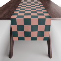 a checkered table cloth on top of a wooden table