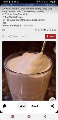 a cup filled with ice cream sitting on top of a table