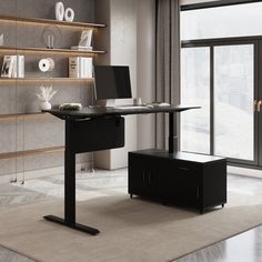 a black desk with a laptop on it in front of a large window and bookshelf