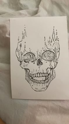 a drawing of a human skull on paper