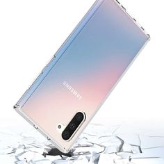 an image of a samsung note 10 in the air with cracked glass on it's sides