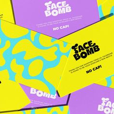 several business cards are stacked on top of each other in different colors and shapes, with the words face bomb printed on them