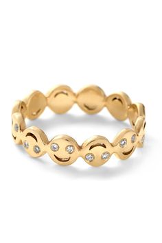 a gold ring with diamonds on it