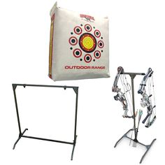 an outdoor range with archery bows and arrows in front of the target bag that is attached to it