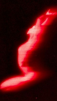 a blurry image of a red object in the dark