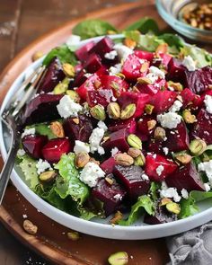 a salad with beets, feta cheese and nuts