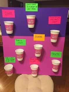 a display board with cups on it that says dare to drink and don't