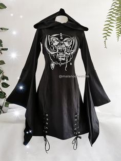 "-Cotton lycra dress with Motorh3ad handmade print on chest. Bell sleeves, oversize hood and stain steel eyelets.  Size XS: chest 84cm/33\" --- waist 58cm/22,6\" --- length  85cm/33,4\"  Size S: chest 88cm/35\"    --- waist  64cm/25,1\" ---length   85cm/33,4\"  Size M: chest 96cm/38\"  ---  waist 72cm/28,3\" --- length  90cm/ 35,4\" Size L: chest 106cm/41\"   ---  waist 82cm/32,2\"  ---length  97cm/38,1\"   Size XL: chest 112cm/44\" - waist  95cm/37,4\"   ---length   100m/ 39,3\" Size 2X: chest Black Long Sleeve Punk Dress, Gothic Dresses For Halloween Cosplay, Gothic Dresses For Halloween And Alternative Fashion, Black Gothic Dress For Fall, Black Gothic Fall Dress, Black Mini Dress For Costume, Black Fall Cosplay Dress, Black Witchy Dress For Cosplay, Witchy Dress For Halloween