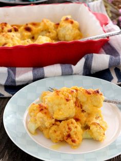 a plate with some food on it next to a casserole dish