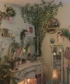 a room with many plants on the wall and mirrors above it, along with other decorations