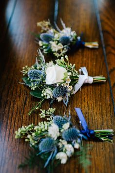 wedding flowers laid out on a wooden table