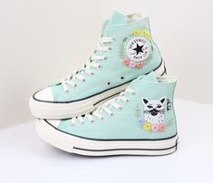 Embroidered converse custom cat/Converse mint green high tops  embroidered pet/Gifts birthday shoes/Personalized name and date  Detailed Product Information - Shoe Type: Converse (high tops or low tops) 👟 - Customization: Hand-embroidered flowers, bees, pets, songs, wedding bouquets, birthdays, wedding dates, and more. We can bring all your ideas to life! ✨🐝 - Material: Durable, unfading embroidery on new shoes purchased directly from the store 🏬 - Note About Size: Converse shoes typically ru Cute High-top Sneakers, Cute High-top Sneakers For Streetwear, Green High-top Sneakers For Spring, Cute Green Sneakers For Spring, Cat Converse, Birthday Shoes, Chuck Taylor Shoes, Embroidered Converse, Converse Custom