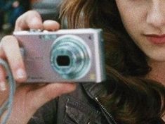 a woman taking a photo with her camera