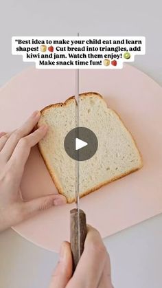 a person cutting a piece of bread on top of a pink plate with a knife