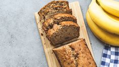 a loaf of banana bread next to some bananas