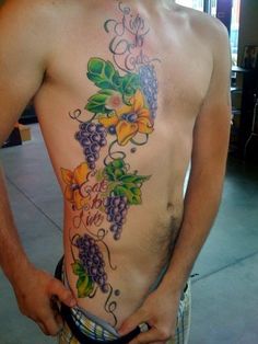 a man with a flower tattoo on his chest