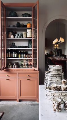 a display case with plates stacked on top of it