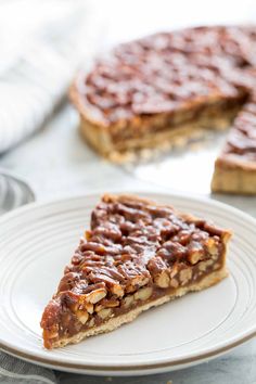 a slice of chocolate pecan pie on a plate