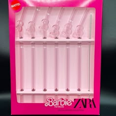 a pink display case with six clear plastic tubes