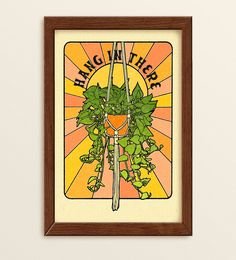 a framed poster with a bicycle on it's front and the words hang there