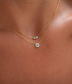 Premium Materials: Expertly crafted from high-quality 925 sterling silver over 14k gold plated or rhodium , ensuring durability and a radiant shine. 💙 Length:16"+2" Combine charm and protection with our Evil Eye Necklace. This unique piece features a heart-shaped pendant with the iconic evil eye symbol, designed to ward off negative energy while adding a touch of elegance to your look. Design: The third eye pendant beautifully incorporates the evil eye symbol, making it both a protective talisman and a stylish accessory. Versatile: Perfect for everyday wear or as a statement piece for special occasions. Perfect Gift: Comes in an elegant gift box, making it an ideal present for birthdays, anniversaries, or any special occasion. **Care Instructions To keep your necklace looking its best, av Blue Spiritual Gold-plated Necklaces, Blue Birthstone Gold-plated Jewelry, Blue Birthstone Jewelry In Gold Plated, Blue Gold-plated Birthstone Jewelry, Symbolic Blue Necklace With Round Pendant, Blue 14k Gold Charm Necklace With Adjustable Chain, Blue Sterling Silver Necklace With Delicate Chain, Everyday Blue Clavicle Chain Necklace, Symbolic Blue Round Pendant Necklace