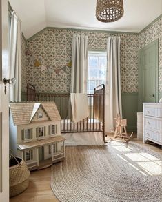 a baby's room with a crib, dresser and bed in the corner