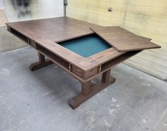 a wooden table with blue glass in the center