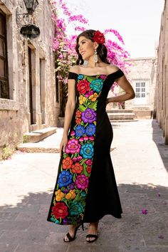 This Beautiful Mexican Floral Dress is the perfect dress for a special event or Mexican Fiesta. It reflects the Mexican culture through its unique embroidered design and vibrant colors. It closes with a zipper on the back for a secure and comfortable fit.  It is embroidered by Artisanal Machine- hand manipulated by Mexican Artisans in Guanajuato, Mexico. It's made out of spandex and is full of embroidered multicolor flowers. Size S - 2X Shop more Mexican Dresses here:  https://www.etsy.com/es/sh Embroidered Dresses With Fitted Bodice For Gala, Embroidered Dress With Fitted Bodice For Gala, Embroidered Gala Dresses With Fitted Bodice, Embroidered Floor-length Dress With Fitted Bodice, Floor-length Dress With Multicolor Floral Embroidery, Embroidered Multicolor Gown For Party, Fitted Floor-length Dress With Multicolor Embroidery, Fitted Multicolor Embroidery Floor-length Dress, Floor-length Fitted Dress With Multicolor Embroidery