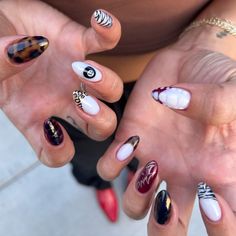 These almond birthday nails feature a striking blend of zebra, leopard, and tortoise shell prints in white, black, brown, and dark red tones.  🍎 Recreate this look yourself with our Korean Gel Nail Polish collection!  🍎 Credit: ts_nails0 on Instagram 🍎 almond nails, birthday nails, mixed nails, mismatched nails, animal print nails, cheetah nails, leopard nails, tortoise nails, tortoise shell nails, zebra nails, fall nails, september nails, baddie nails, french nails, black nails, brown nails, red nails, white nails, 8 ball nails, Korean gel nail polish, nail art, trendy nails, nail inspiration, gel nails, Instagram nail art, summer to fall transition nails, autumn nails How To Do Cheetah Nails, Red Graphic Nails, Leopard White Nails, Tortoise Fall Nails, Cheetah Acrylic Nail Designs, Chrome Cheetah Nails, Almondetto Nails Designs, Fall Nails Animal Print, Best Nails 2024