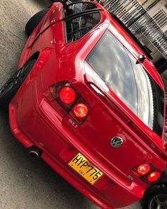 the rear end of a red sports car