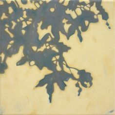 an abstract painting of leaves on a yellow background