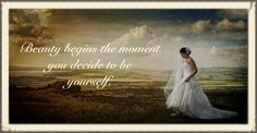 a woman in a wedding dress standing on top of a hill with the words beauty begins the moment you decide to be yourself