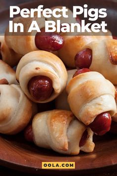 a plate full of hotdogs wrapped in crescented bread with the words, perfect pigs in a blanket