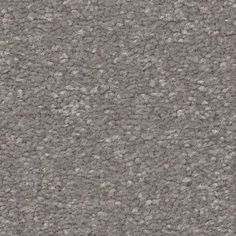 a gray carpet textured with small white dots