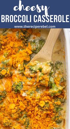 cheesy broccoli casserole in a white dish with a wooden spoon