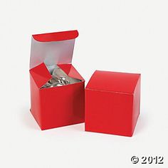 two red boxes with silver coins in them