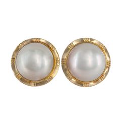 These elegant 14K Yellow Gold Mabe Button Pearl Stud Earrings feature lustrous, high-quality Mabe pearls set in a sleek yellow gold design. The smooth, round shape and timeless appeal make these earrings a perfect addition to any jewelry collection.  Material: 14K Yellow Gold Weight: 7.1g Diameter: 17 mm Pearls: 13 mm Mabe Button Pearl  For more of our jewelry products, please visit our shop 777jewelryLA  Free shipping on all orders within USA. International shipping available.  We only sell real gold jewelry. We do not sell gold plated or gold filled jewelry.  We offer a 30 day money back guaranteed return on all orders. Our goal is to make every customer satisfied. Ring Bracelet Chain, Real Gold Jewelry, Mabe Pearl, Sell Gold, Pearl Set, Pearl Stud Earrings, Fine Jewellery Earrings, Gold Filled Jewelry, Pearl Studs