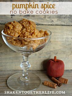 pumpkin spice no bake cookies in a glass bowl next to cinnamon sticks and an apple