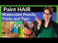 a woman with long hair and glasses holding up her hand in front of colored pencils