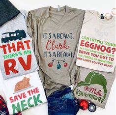 four t - shirts with different sayings on them are laid out next to each other