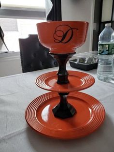 two orange dishes on top of each other