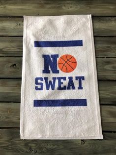 a white towel with the words no sweat on it and a basketball in blue letters