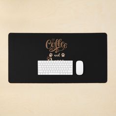 a computer mouse pad with the words coffee and cats on it next to a keyboard