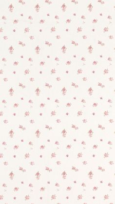 a white and pink wallpaper with small floral designs on it's side,