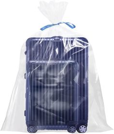 two pieces of luggage wrapped in plastic