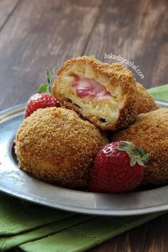 some strawberries are sitting on a plate