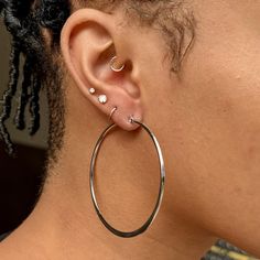 Light and naturally elegant. Add a touch of sophistication to your everyday style with our Classic Silver Flat Hoop Earrings. ✔Hypoallergenic ✔Quality Guaranteed ✔Water Resistant ✔Handmade ✔Nickel Free COLOR: Silver MATERIAL: stainless steel SIZE: 2.4 inch diameter Earring Stack Silver, Double Piercing Earrings, Flat Hoop Earrings, Double Piercing, Mens Earrings Hoop, Earrings Hypoallergenic, Silver Flats, Unique Handmade Jewelry